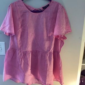 Lane Bryant’s Illusion Collection pink top.